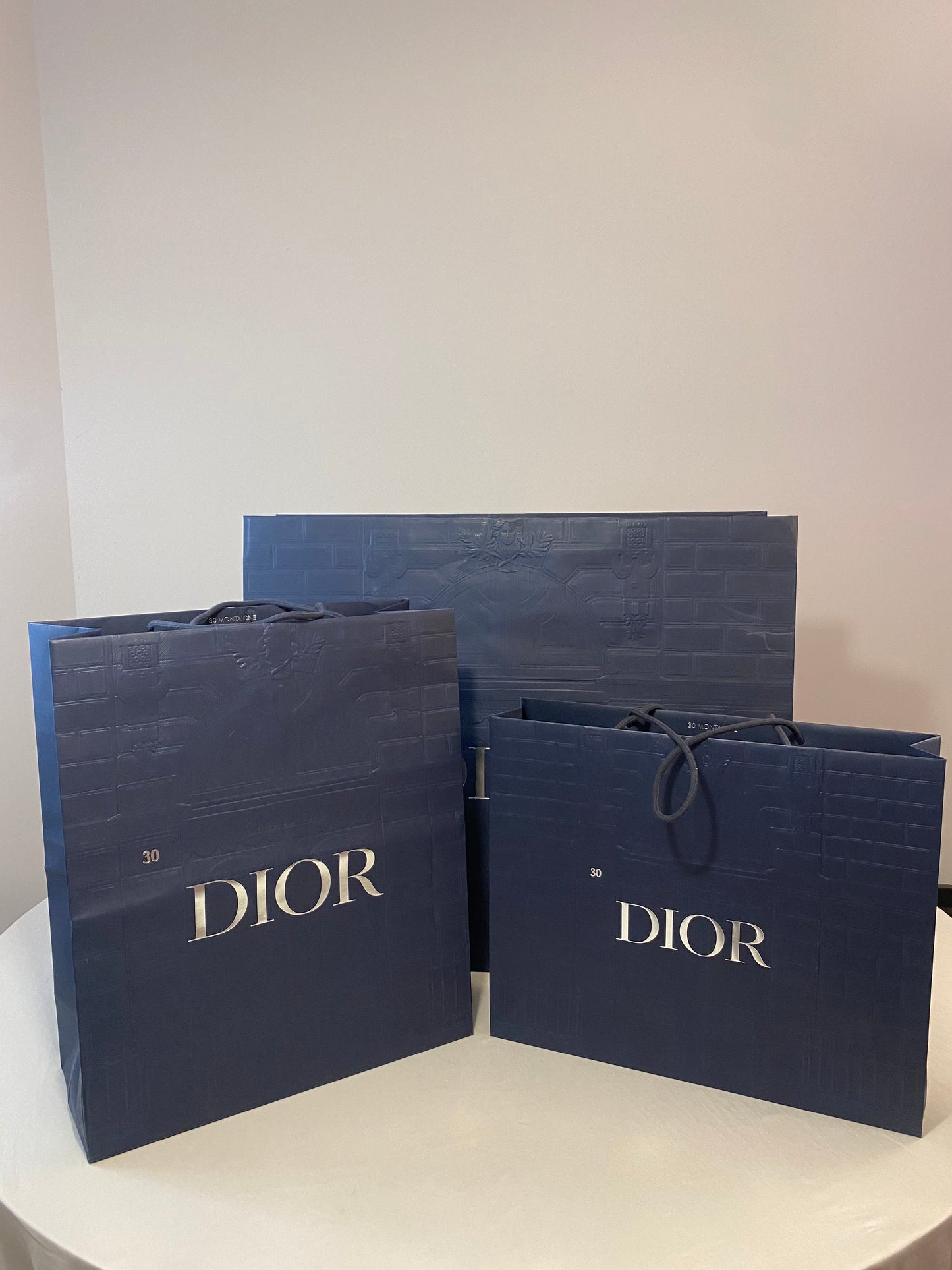 Sac shopping Dior bleu avec relief, différentes tailles